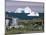 Painted Wooden Fisherman's House in Front of Icebergs in Disko Bay, Disko Island, Greenland-Tony Waltham-Mounted Photographic Print