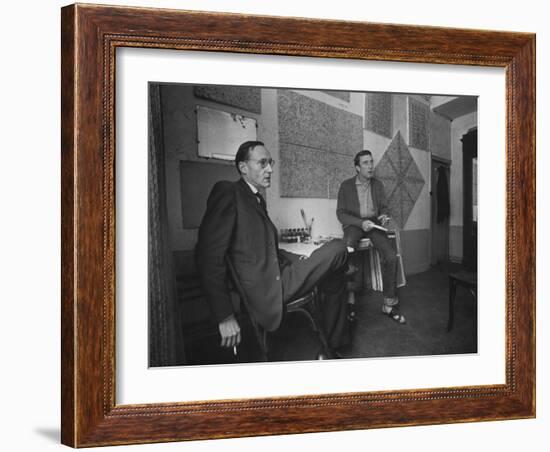 Painter Brion Gysin, Shown W His Paintings in Hotel Room in with Writer William S. Burroughs-Loomis Dean-Framed Photographic Print