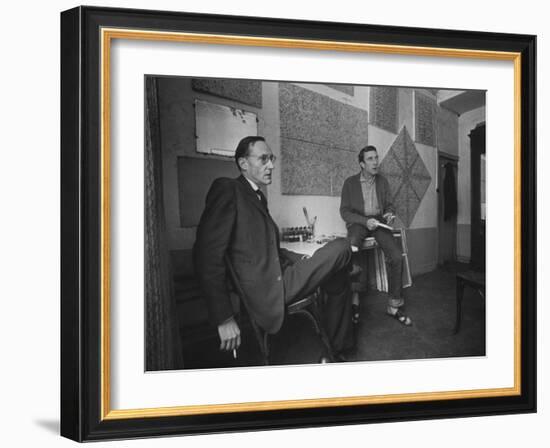 Painter Brion Gysin, Shown W His Paintings in Hotel Room in with Writer William S. Burroughs-Loomis Dean-Framed Photographic Print