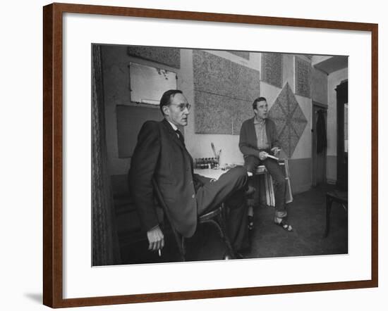 Painter Brion Gysin, Shown W His Paintings in Hotel Room in with Writer William S. Burroughs-Loomis Dean-Framed Photographic Print