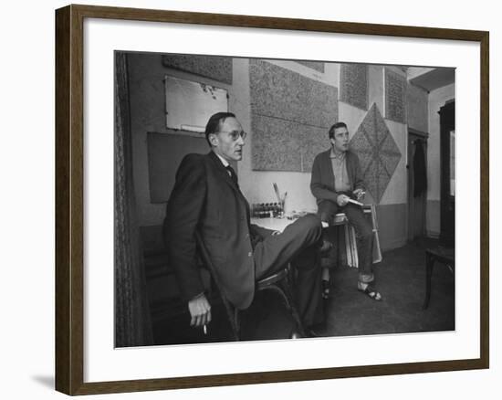 Painter Brion Gysin, Shown W His Paintings in Hotel Room in with Writer William S. Burroughs-Loomis Dean-Framed Photographic Print