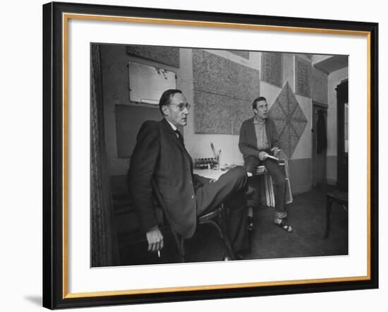 Painter Brion Gysin, Shown W His Paintings in Hotel Room in with Writer William S. Burroughs-Loomis Dean-Framed Photographic Print