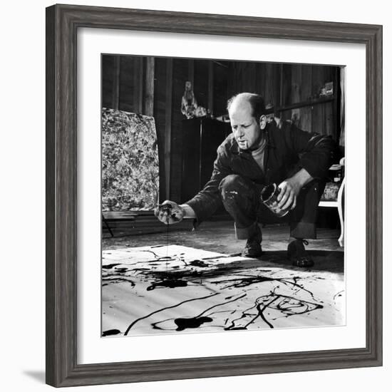 Painter Jackson Pollock Working in His Studio, Cigarette in Mouth, Dropping Paint onto Canvas-Martha Holmes-Framed Premium Photographic Print