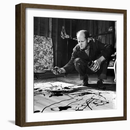 Painter Jackson Pollock Working in His Studio, Cigarette in Mouth, Dropping Paint onto Canvas-Martha Holmes-Framed Premium Photographic Print