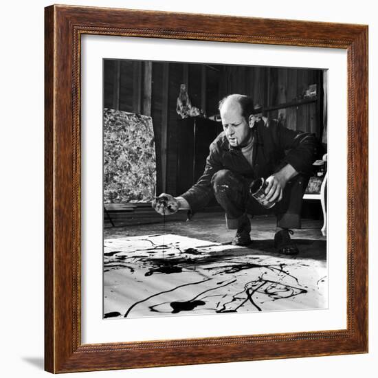 Painter Jackson Pollock Working in His Studio, Cigarette in Mouth, Dropping Paint onto Canvas-Martha Holmes-Framed Premium Photographic Print