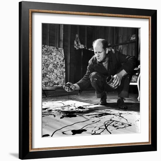 Painter Jackson Pollock Working in His Studio, Cigarette in Mouth, Dropping Paint onto Canvas-Martha Holmes-Framed Premium Photographic Print