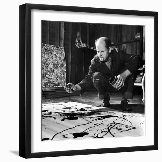 Painter Jackson Pollock Working in His Studio, Cigarette in Mouth, Dropping Paint onto Canvas-Martha Holmes-Framed Premium Photographic Print