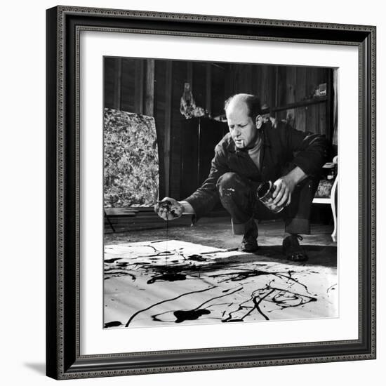 Painter Jackson Pollock Working in His Studio, Cigarette in Mouth, Dropping Paint onto Canvas-Martha Holmes-Framed Premium Photographic Print