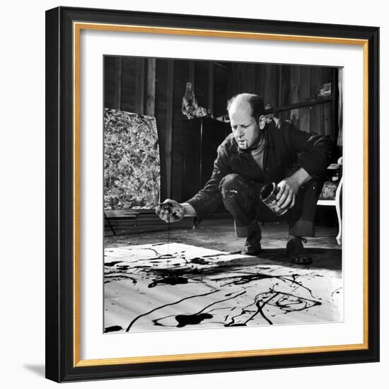 Painter Jackson Pollock Working in His Studio, Cigarette in Mouth, Dropping Paint onto Canvas-Martha Holmes-Framed Premium Photographic Print