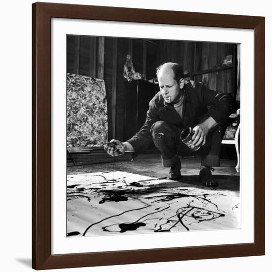 Painter Jackson Pollock Working in His Studio, Cigarette in Mouth, Dropping Paint onto Canvas-Martha Holmes-Framed Premium Photographic Print