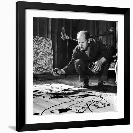 Painter Jackson Pollock Working in His Studio, Cigarette in Mouth, Dropping Paint onto Canvas-Martha Holmes-Framed Premium Photographic Print