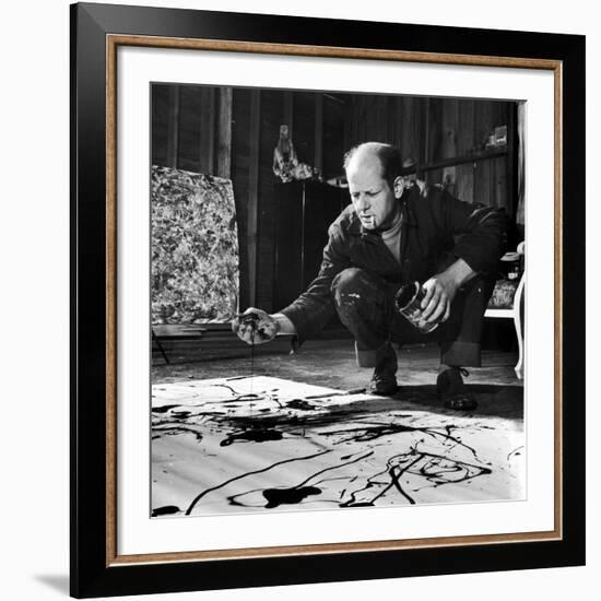 Painter Jackson Pollock Working in His Studio, Cigarette in Mouth, Dropping Paint onto Canvas-Martha Holmes-Framed Premium Photographic Print