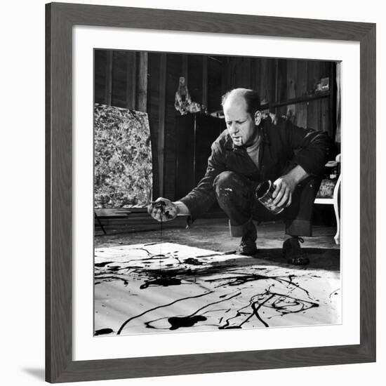 Painter Jackson Pollock Working in His Studio, Cigarette in Mouth, Dropping Paint onto Canvas-Martha Holmes-Framed Premium Photographic Print