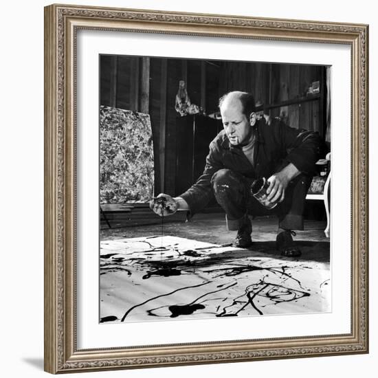 Painter Jackson Pollock Working in His Studio, Cigarette in Mouth, Dropping Paint Onto Canvas-Martha Holmes-Framed Photographic Print