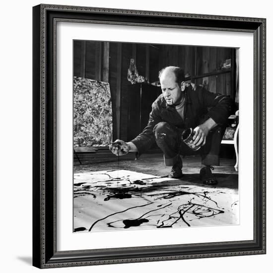 Painter Jackson Pollock Working in His Studio, Cigarette in Mouth, Dropping Paint Onto Canvas-Martha Holmes-Framed Photographic Print