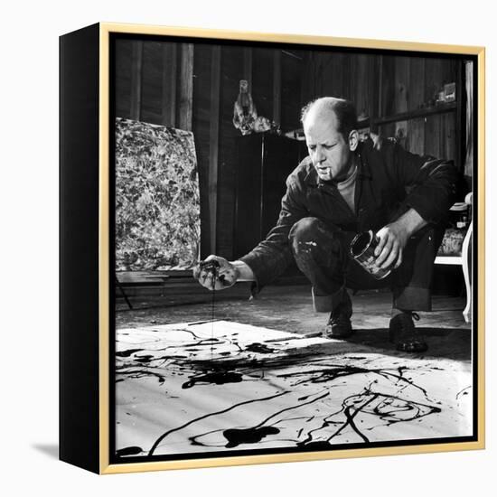 Painter Jackson Pollock Working in His Studio, Cigarette in Mouth, Dropping Paint Onto Canvas-Martha Holmes-Framed Premier Image Canvas