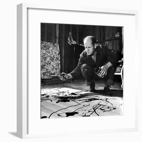 Painter Jackson Pollock Working in His Studio, Cigarette in Mouth, Dropping Paint Onto Canvas-Martha Holmes-Framed Premium Photographic Print