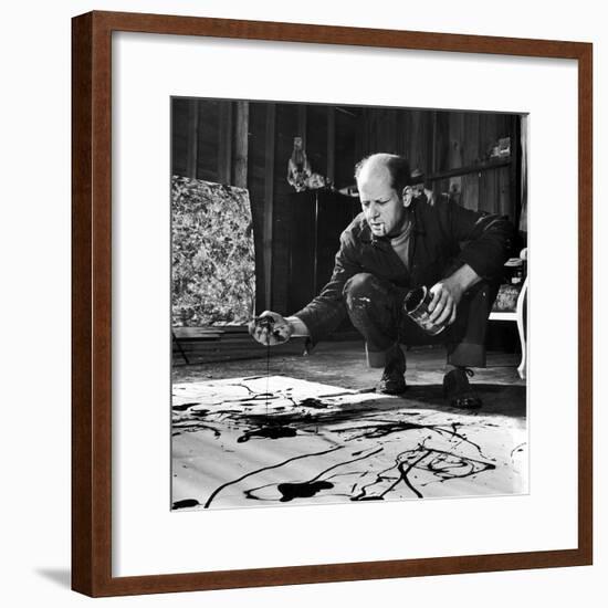 Painter Jackson Pollock Working in His Studio, Cigarette in Mouth, Dropping Paint Onto Canvas-Martha Holmes-Framed Premium Photographic Print