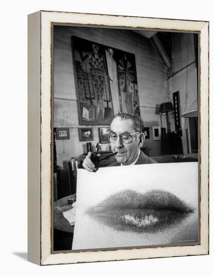 Painter Photographer Man Ray Holding Up "Lips" Print, Winking at Camera and Smoking a Pipe-Loomis Dean-Framed Premier Image Canvas