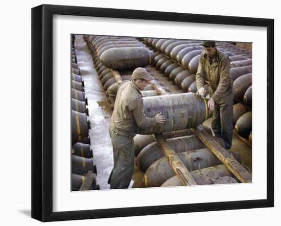 Pair of American Servicemen Moving a Large Bomb at an Ammunition Dump During WWII-null-Framed Photographic Print