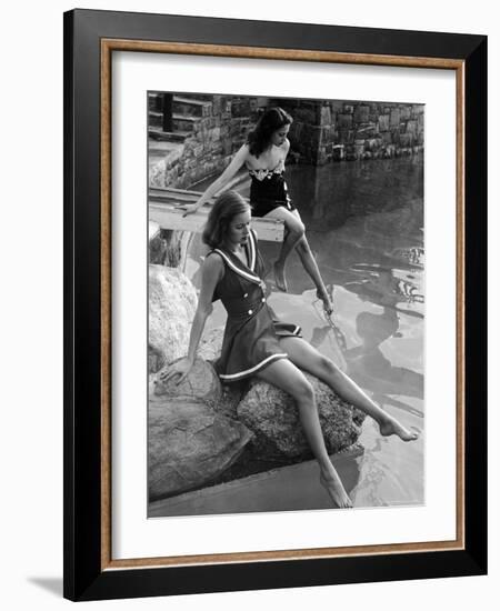 Pair of Models Showing Off New Bathing Suits on the Banks of the River-Nina Leen-Framed Photographic Print