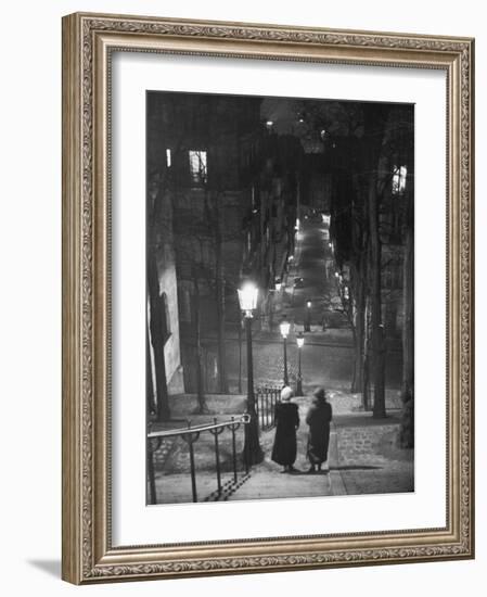 Pair of Prostitutes Descending Stairs after Dark in Montmartre-Alfred Eisenstaedt-Framed Photographic Print