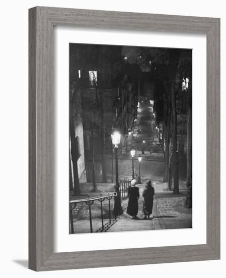 Pair of Prostitutes Descending Stairs after Dark in Montmartre-Alfred Eisenstaedt-Framed Photographic Print