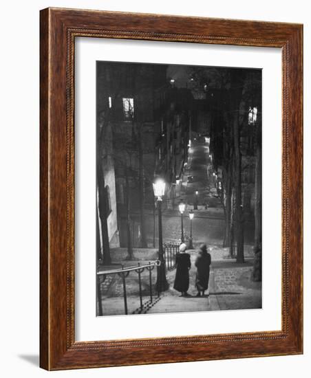 Pair of Prostitutes Descending Stairs after Dark in Montmartre-Alfred Eisenstaedt-Framed Photographic Print