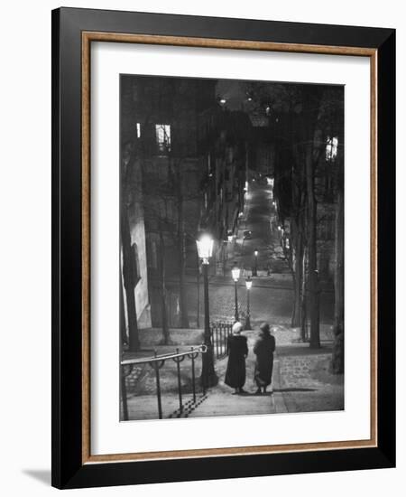 Pair of Prostitutes Descending Stairs after Dark in Montmartre-Alfred Eisenstaedt-Framed Photographic Print