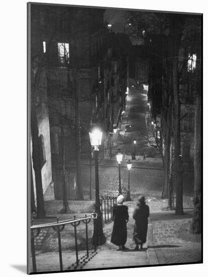 Pair of Prostitutes Descending Stairs after Dark in Montmartre-Alfred Eisenstaedt-Mounted Photographic Print