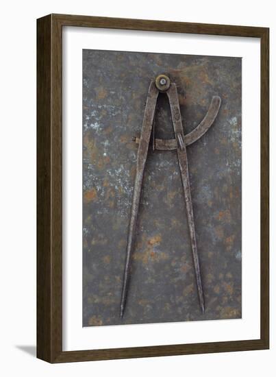 Pair of Vintage Tarnished Measuring Dividers Or Compasses Lying On Rusty Metal Sheet-Den Reader-Framed Photographic Print