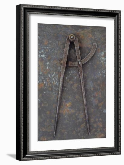 Pair of Vintage Tarnished Measuring Dividers Or Compasses Lying On Rusty Metal Sheet-Den Reader-Framed Photographic Print