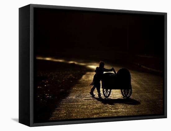 Pakistani Boy Pushes a Cart Along the Main Street in Rawalpindi, Pakistan-null-Framed Premier Image Canvas