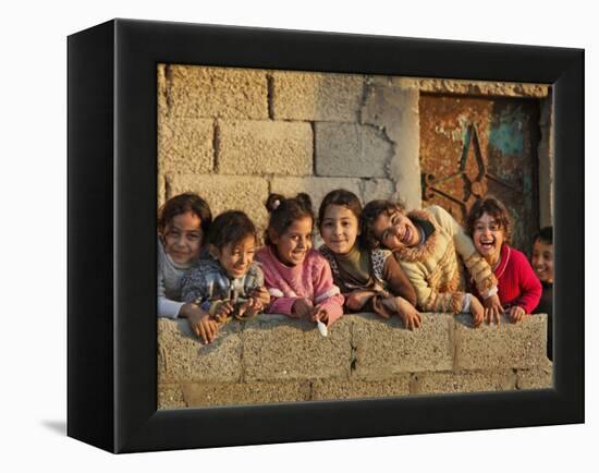 Palestinian Girls Giggle While Photographed Where Shell from an Israeli Gunboat Landed Earlier-null-Framed Premier Image Canvas