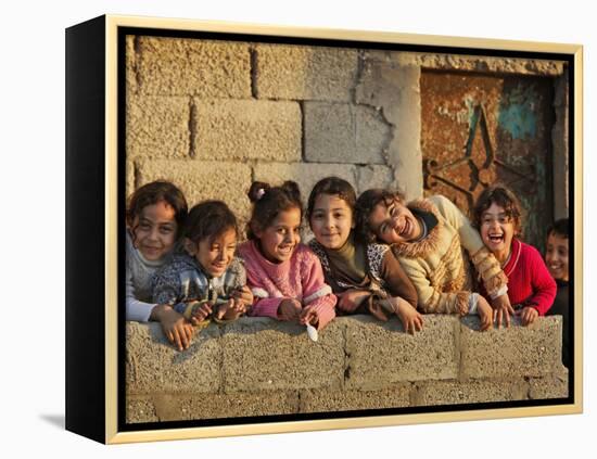 Palestinian Girls Giggle While Photographed Where Shell from an Israeli Gunboat Landed Earlier-null-Framed Premier Image Canvas