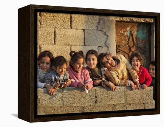 Palestinian Girls Giggle While Photographed Where Shell from an Israeli Gunboat Landed Earlier-null-Framed Premier Image Canvas