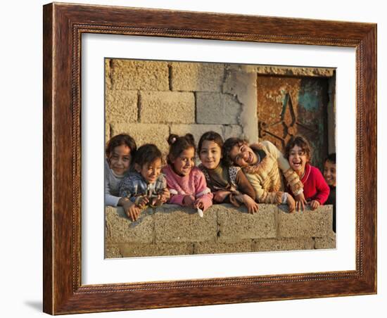 Palestinian Girls Giggle While Photographed Where Shell from an Israeli Gunboat Landed Earlier-null-Framed Photographic Print