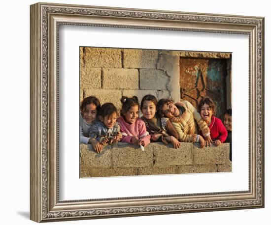 Palestinian Girls Giggle While Photographed Where Shell from an Israeli Gunboat Landed Earlier-null-Framed Photographic Print