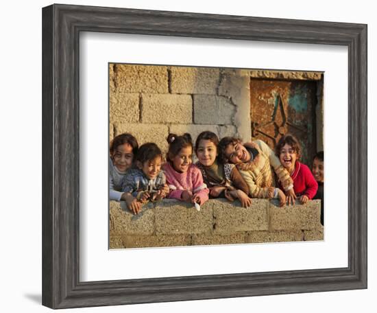 Palestinian Girls Giggle While Photographed Where Shell from an Israeli Gunboat Landed Earlier-null-Framed Photographic Print