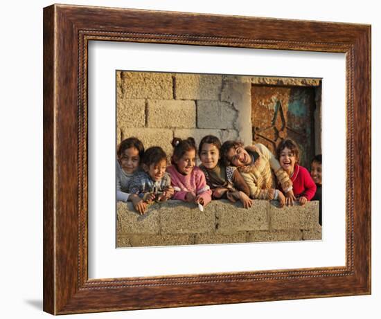 Palestinian Girls Giggle While Photographed Where Shell from an Israeli Gunboat Landed Earlier-null-Framed Photographic Print