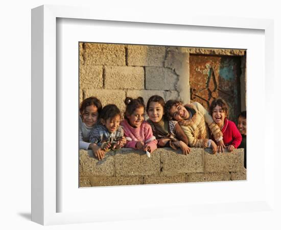 Palestinian Girls Giggle While Photographed Where Shell from an Israeli Gunboat Landed Earlier-null-Framed Photographic Print