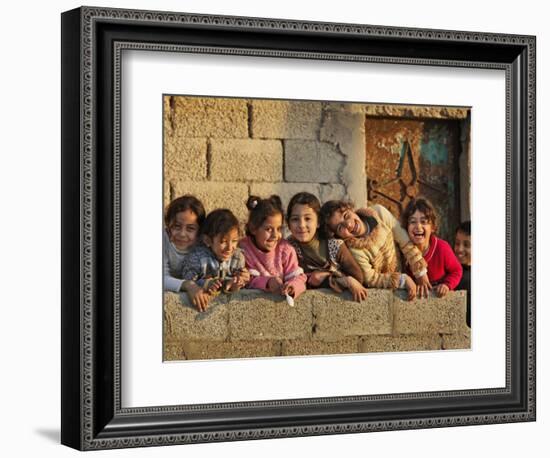 Palestinian Girls Giggle While Photographed Where Shell from an Israeli Gunboat Landed Earlier-null-Framed Photographic Print