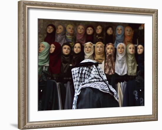 Palestinian Man Passes in Front of a Shop Offering Veils for Sale in Jerusalem's Old City-null-Framed Photographic Print