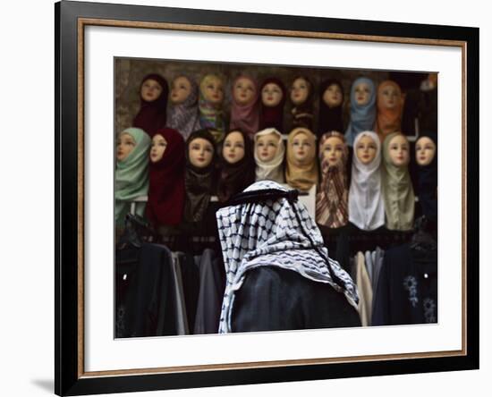 Palestinian Man Passes in Front of a Shop Offering Veils for Sale in Jerusalem's Old City-null-Framed Photographic Print