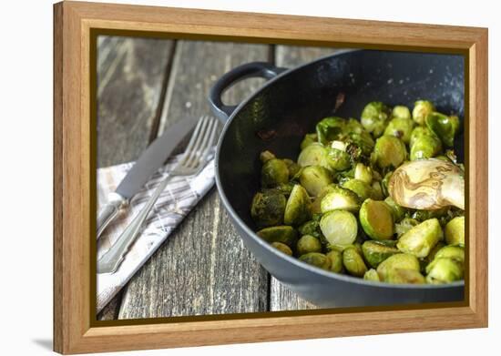 Pan-Fried Brussels Sprouts in Cast-Iron Frying Pan on Wooden Table-Jana Ihle-Framed Premier Image Canvas