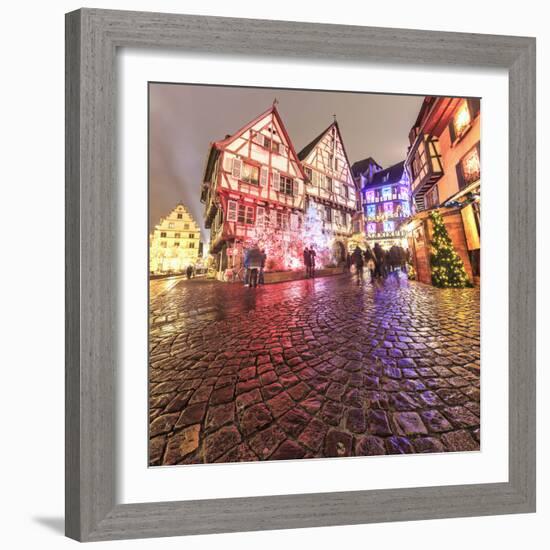 Panorama of typical houses enriched by Christmas ornaments and lights at dusk, Colmar, Haut-Rhin de-Roberto Moiola-Framed Photographic Print