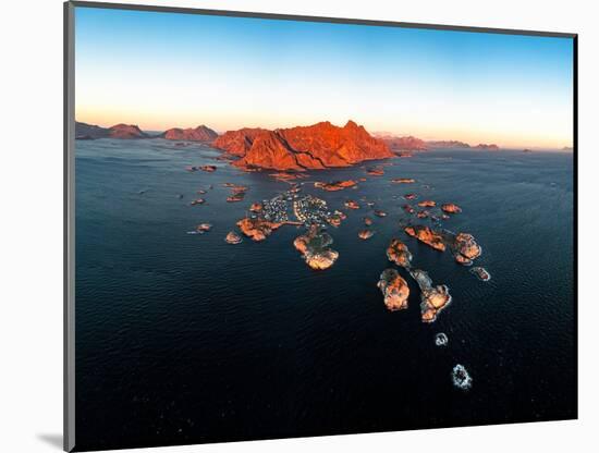 Panoramic aerial view of the fishing village of Henningsvaer and mountains at sunset-Roberto Moiola-Mounted Photographic Print