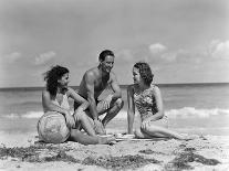 1930s 1940s TWO WOMEN ONE MAN IN BATHING SUITS SITTING ON BEACH-Panoramic Images-Photographic Print