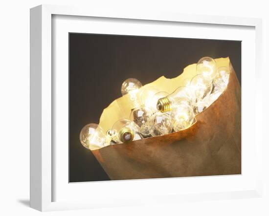 Paper Bag Full of Glass Light Bulbs-null-Framed Photographic Print