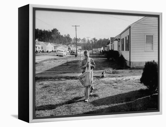 Paper Boy Delivering Newspapers in His Neighborhood-Ed Clark-Framed Premier Image Canvas